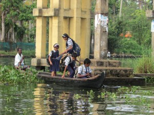 Children going to school via boat in the backwaters of Alleppey