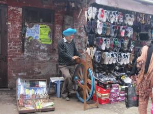 Man sharpening knives on the street