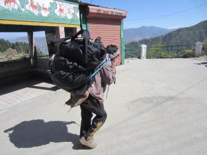 Porter carrying our bags