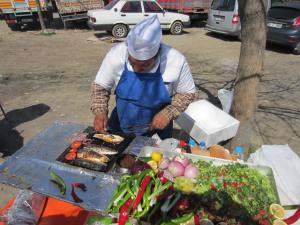 Istanbul man making us a fresh fish sandwich