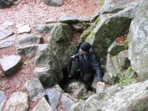 Andy emerging from a cave at the monastery, now he is free of sins