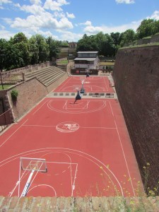 New basketball court with old bleachers from the Fortress